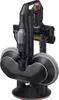 A black cordless vacuum cleaner with gray accents and copper details is displayed on its charging stand. Podgląd zdjęcia produktu
