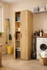 A utility room or laundry area with a tall cabinet, washing machine, vacuum cleaner, and cleaning supplies. Anteprima dell’immagine prodotto