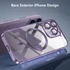 A close-up shot of a clear iPhone case with purple metallic trim, showing the MagSafe ring and camera protection. Another iPhone is visible in the background. Produktbild-Vorschau