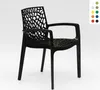 A black plastic chair with an intricate, web-like pattern on the back and seat, shown against a white background. A small color swatch palette is visible in the upper right corner. Produktbild-Vorschau