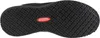 The image shows the sole of a black shoe with a textured grip pattern. A red oval logo with white text is visible in the center of the sole. Produktbild-Vorschau