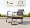 A rocking chair on a patio with a background of greenery and a body of water. Náhled obrázku produktu