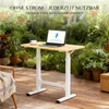 A height-adjustable desk with a laptop and a cup of coffee is set up on a wooden deck surrounded by lush greenery and hanging plants. Voir les images du produit