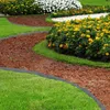 A garden path with decorative edging and flowers. Produktbild-Vorschau