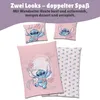 A flat lay of Lilo & Stitch themed bedding with two pillowcases and a duvet cover, featuring Stitch character graphics. Produktbild-Vorschau