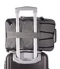A close-up view of two pieces of luggage stacked on top of each other, with the focus on the handle and strap system connecting them. Produktbild-Vorschau