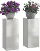 Two plant stands with potted plants on top, set against a white background. Náhled obrázku produktu