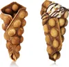 Two bubble waffle cones, one empty and one filled with ice cream and chocolate sauce, are displayed against a white background. Produktbild-Vorschau