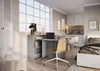 A modern studio apartment with a desk area and a bed. Produktbild-Vorschau