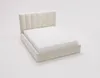 A cream-colored upholstered bed frame with a white mattress on a white background. Náhled obrázku produktu
