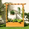 A wooden planter box with a trellis and hanging plants, set on a lawn in front of a wall with shadows. Náhled obrázku produktu