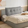 A grey wedge pillow is placed on a bed. Produktbild-Vorschau