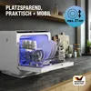 A compact dishwasher is shown open on a kitchen countertop, filled with dishes, with blue interior lighting. Produktbild-Vorschau