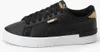 A single black Puma sneaker with gold accents and a white sole is shown against a white background. Podgląd zdjęcia produktu
