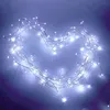 A string of white LED lights arranged in a heart shape on a gradient background. Produktbild-Vorschau