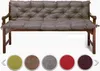 A tufted bench cushion on a wooden bench, with swatches of different color options below. Produktbild-Vorschau