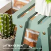 Close-up of a light green wooden plant stand with a cactus in a pot and a white pot with a plant on it in the background. Produktbild-Vorschau