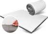 A mattress topper is shown unrolled and partially rolled up, with a close-up inset of a hand zipping the cover. Produktbild-Vorschau