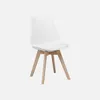 A white chair with wooden legs on a white background. Anteprima dell’immagine prodotto