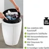 A person is placing a laundry bag into a white storage stool. The stool is shown from a diagonal angle. Náhľad obrázku produktu