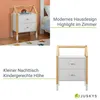 A collage of images showing a white and wood bedside table with a house-shaped frame, with text overlays describing its features. Produktbild-Vorschau