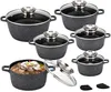 A set of granite-coated pots and pans with glass lids, with one pot filled with food. Náhled obrázku produktu