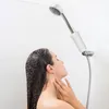 A woman is showering in a bathroom. Anteprima dell’immagine prodotto