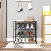A shoe rack filled with shoes, next to a cabinet and door. Produktbild-Vorschau