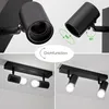 A collage of images showing a black ceiling lamp with adjustable spotlights, demonstrating its rotation and tilt features, and showing it installed on a ceiling. Produktbild-Vorschau