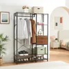 A bedroom or dressing area with a wardrobe rack and a bed in the background. Náhled obrázku produktu