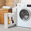 A narrow white cabinet with shelves filled with toiletries is placed next to a white washing machine in a laundry room. Produktbild-Vorschau