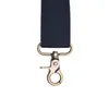 A close-up of a black strap with a bronze metal clasp. Anteprima dell’immagine prodotto