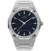A close-up, front-facing view of a frosted silver watch with a dark blue, starry dial. Produktbild-Vorschau