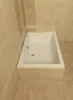 A white bathtub is shown in a tiled bathroom. Produktbild-Vorschau