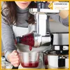 A person is using a Kenwood food processor attachment to juice berries into a measuring cup. Anteprima dell’immagine prodotto