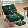 A green corduroy armchair with a footrest is shown in a living room setting, with text overlays highlighting ergonomic features. Anteprima dell’immagine prodotto