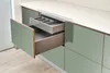 A modern kitchen drawer with a cutlery organizer inside. Produktbild-Vorschau