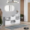 A white shoe cabinet with multiple compartments is shown in a hallway setting. Voir les images du produit