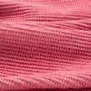 A close-up view of a textured pink fabric. Produktbild-Vorschau