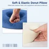 A donut pillow with a hand pressing into it, and a close-up of the foam material. Produktbild-Vorschau