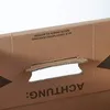 Close-up of the handle and printed text on a cardboard box. Produktbild-Vorschau