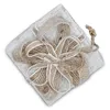 A top-down view of a decorative gift box tied with twine. Náhľad obrázku produktu
