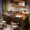 A modern home office setup with a wooden desk, chairs, and a shelf with books and decor. Anteprima dell’immagine prodotto