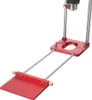 A close-up, angled view of a red and silver drill guide locator tool against a white background. Náhled obrázku produktu