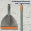 A dustpan and brush set is shown against a textured wall. A blue line with text indicates a feature. Produktbild-Vorschau