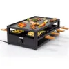 A black steel Princess Raclette grill with food items on top and in the lower compartments. Produktbild-Vorschau