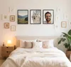 A bedroom scene with a bed, nightstand, and wall decor. Produktbild-Vorschau