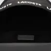 A close-up view of the interior opening of a black backpack, showing the brand name on the strap and a logo tag inside. Anteprima dell’immagine prodotto