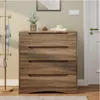 A wooden chest of drawers with four drawers is shown in a room, next to a coat rack and a door. Náhled obrázku produktu