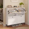 A white shoe cabinet with multiple compartments and drawers, filled with shoes and accessories, placed in a hallway or entrance area. Náhľad obrázku produktu
